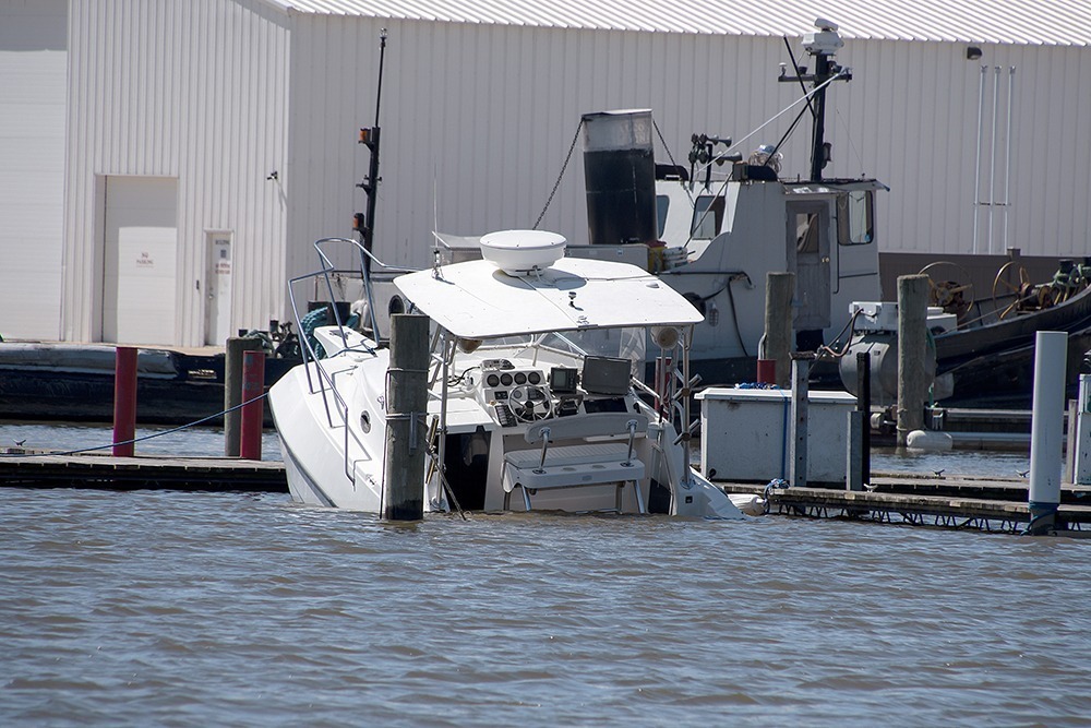 Naples boating accident attorney discussing legal options with injured client after watercraft collision.
