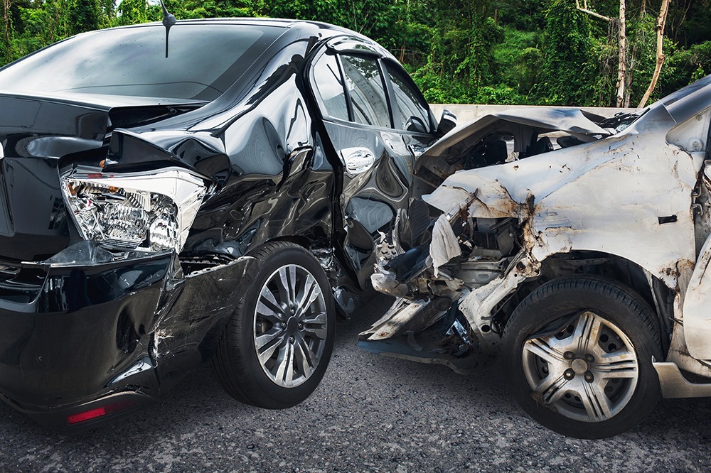 Scene of a serious car accident with vehicle damage and first responders on site in Florida