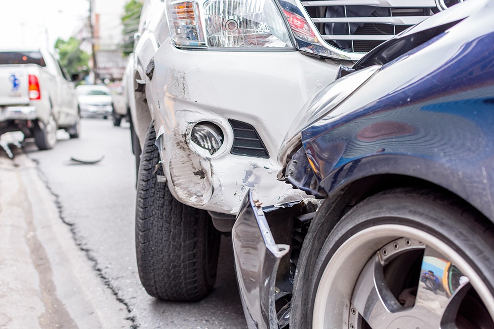 Car accident scene showing damaged vehicles after a collision – Florida and Georgia car accident lawyers at DuFault Law fight for injured victims’ compensation.