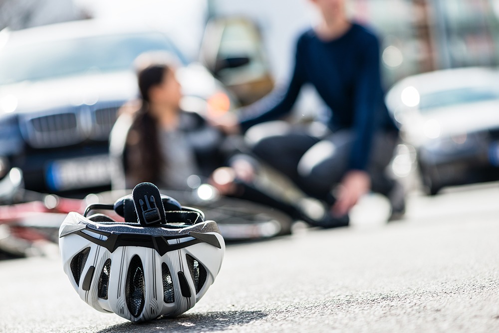 Bicycle accident in Florida involving a cyclist struck by a car, highlighting common causes of bike crashes and personal injury risks.