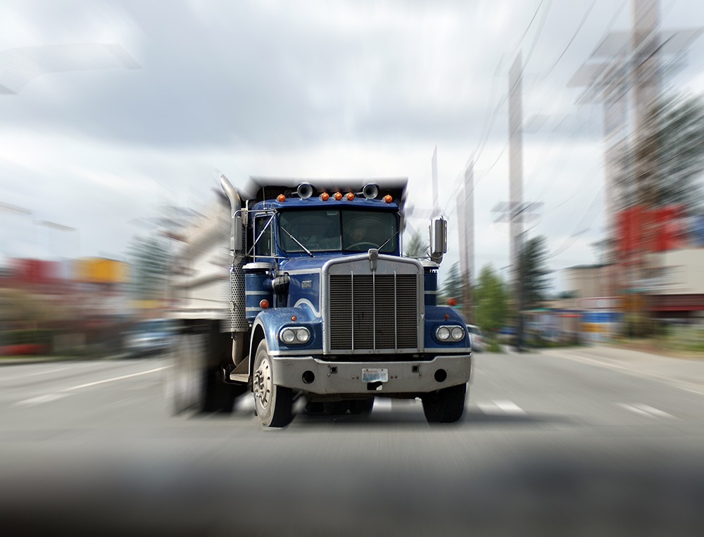 Semi-truck accident on Florida highway caused by driver fatigue and Hours-of-Service violations, illustrating risks of commercial trucking crashes.